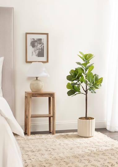 Kate and Laurel 4ft. Fidmont Faux Fiddle Fig Tree with White Planter
